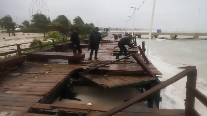 Yucatan State police inspect damage at the harbor from Hurricane Milton in Progreso, Yucatan state, Mexico